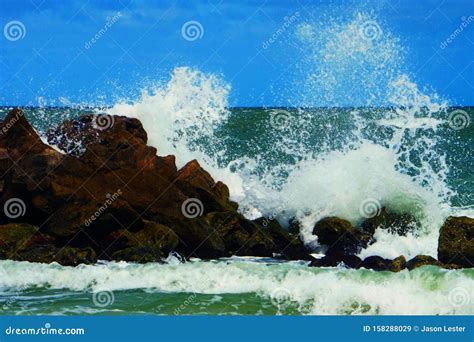 Ocean Waves Crashing On Rocks At Clearwater Beach Florida Stock Image
