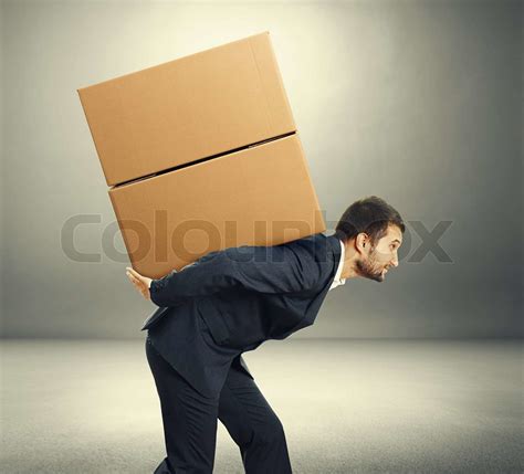 Man Carrying Two Heavy Boxes Stock Image Colourbox