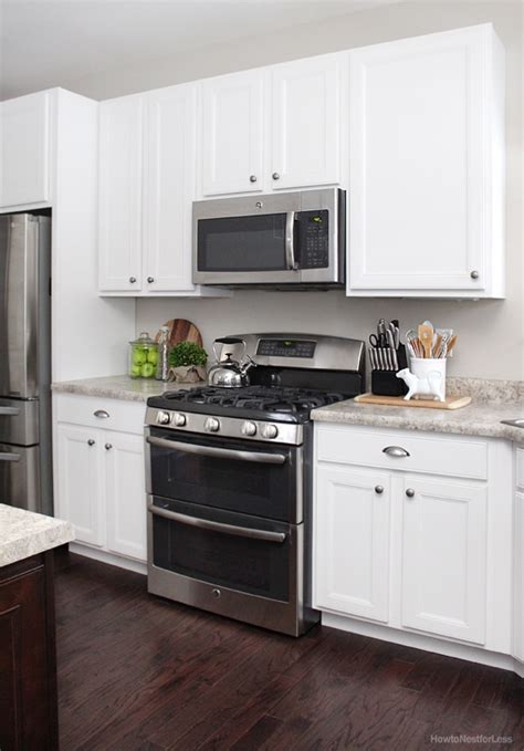 White cabinets come in numerous designs. Kitchen Updates and Bar Stool Ideas - How to Nest for Less™