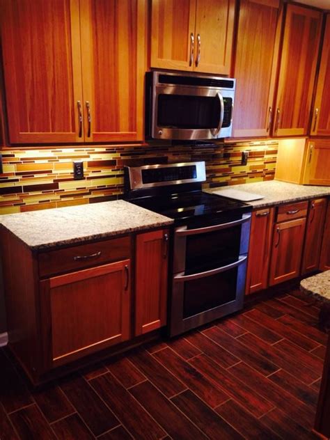 Let our design and installation team work with you to transform your kitchen or bath from ordinary to extraordinary with solid wood cabinets and hardware. Kitchen cabinet - HomeCrest Arbor Hickory Light cabinets ...