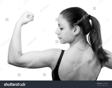 Muscular Young Fitness Girl Flexing Her Stock Photo 551878186