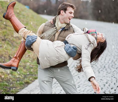 Man Carrying Woman Not Box Not Case Hi Res Stock Photography And Images