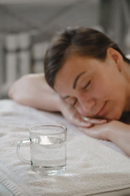 Premium Photo Drinking Clean Water After Massage Therapy Dehydration