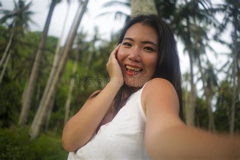 Young Beautiful And Happy Asian Chinese Woman Taking Selfie Portrait