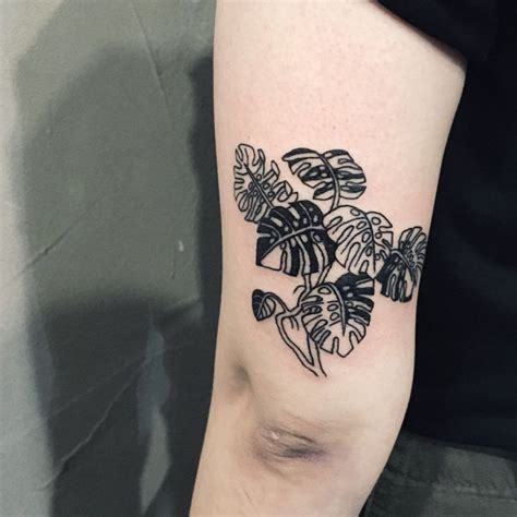 Black Monstera Plant Tattoo On The Back Of The Left Arm Plant Tattoo