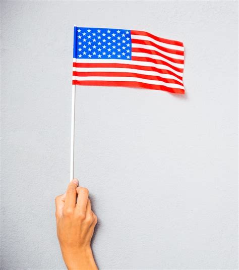 Premium Photo Hand Holding American Flag