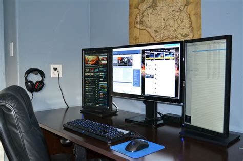 Three Monitor Setup One Large In Middle Two Portrait On Each Side In