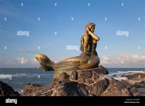 Golden Mermaid Statue On Samila Beach In Sunset Light Songkhla