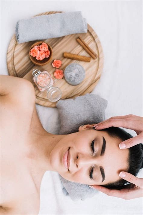Premium Photo Woman Receiving A Relaxing Facial Massage Facial