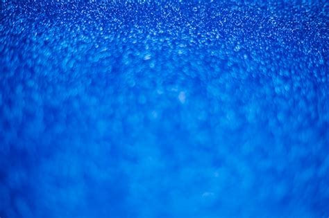 Premium Photo Blurry Shimmering Background Of Blue Sequins Silver