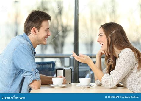 Happy Couple Talking And Flirting On A Coffee Shop Stock Image Image