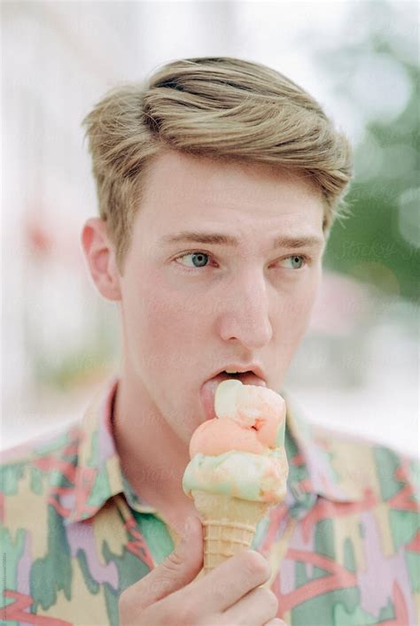 Preppy Hipster Man Eating Ice Cream By Stocksy Contributor CWP LLC