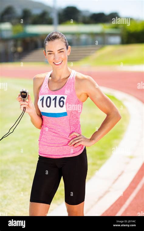 Portrait Of Female Athlete Showing Stopwatch Stock Photo Alamy