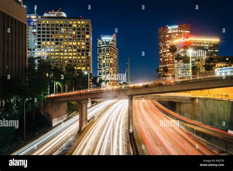 Traffic On The 110 Freeway And Buildings In Los Angeles At Night Seen