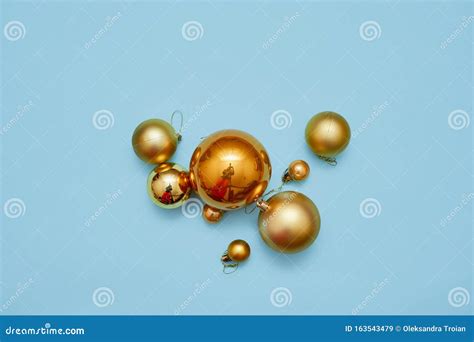 Golden Metal Balls On Blue Background Top View Christmas Decoration