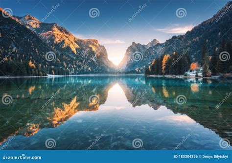 Lake In Fog With Reflection Of Mountains At Sunrise In Autumn Stock