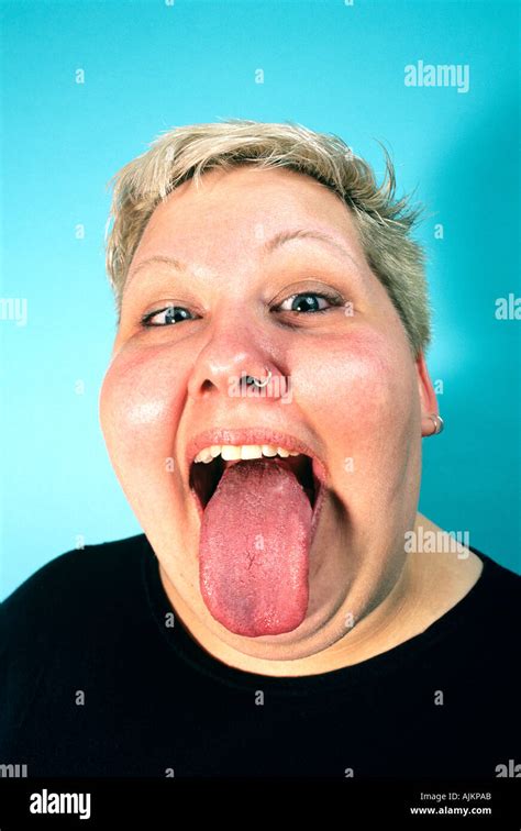 WOMAN STICKING TONGUE OUT Stock Photo Alamy