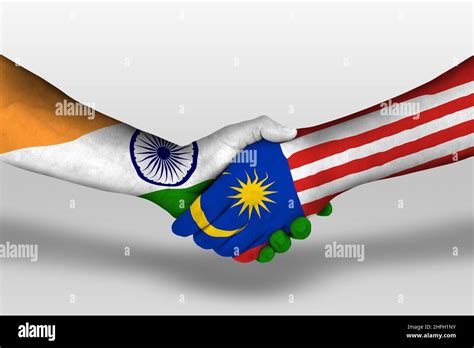 Handshake Between Malaysia And India Flags Painted On Hands
