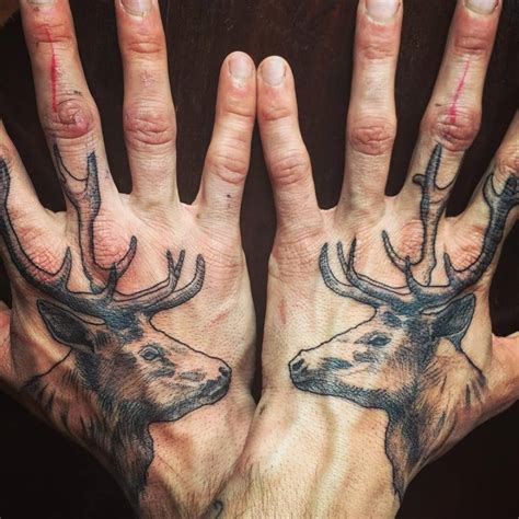 Matching Deer Head Tattoos On The Hands