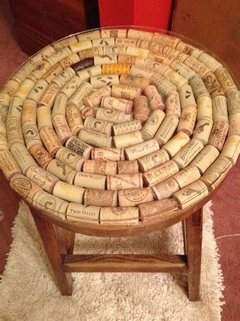 A Table Made Out Of Wine Corks Sitting On Top Of A Rug