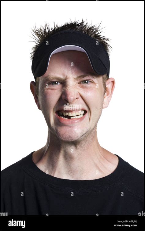 Disheveled Man With A Visor Grinning Stock Photo Alamy