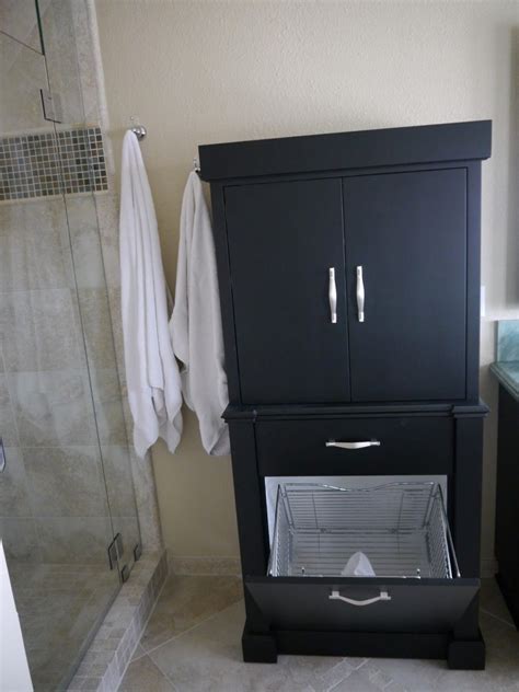 Looking for a stylish bathroom vanity with linen cabinet? Mesmerizing Linen Cabinet With Hamper In The Bathroom And ...