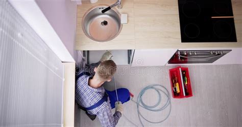 Plumber Drain Cleaning Services In Kitchen Stock Photo Image Of