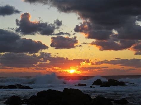 Beautiful Colorful Sunset Dawn Over Sea Waves Hitting Rocky Stone Beach