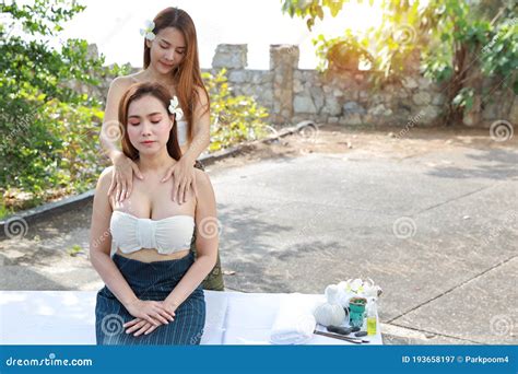 Breast Massage 2 Beautiful And Asian Young Woman In White Dress Enjoying Oil Spa Massage Salon