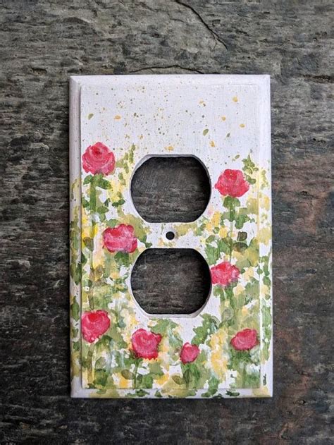 The most common wood wall plate material is wood. Single Outlet Painted Pink with Red Roses Wooden ...