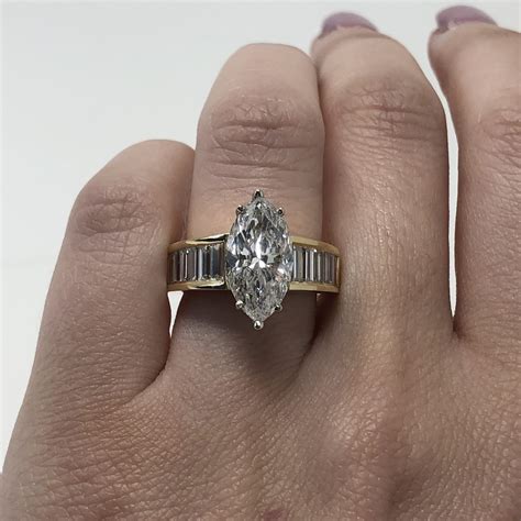 18k Yellow Gold 339ct Marquise Cut Diamond Ring With Baguette Diamonds