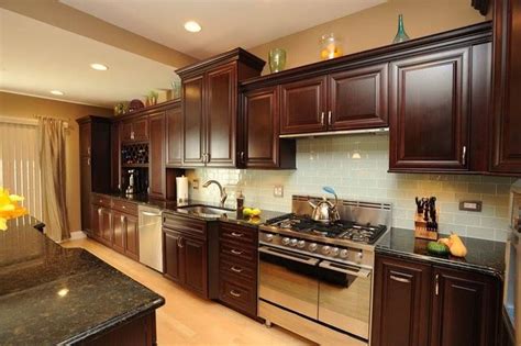 It's actually deep and dark in color, mainly stark black but with a darker cabinets paired with dark countertops create an elegant look but paired with lighter cabinets it can still work wonders. Uba Tuba Granite Countertops (Pictures, Cost, Pros & Cons)