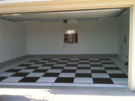 You can change the entire look of your garage (or basement) with a this weekend warrior project. Garage Floor painted checkerboard black and white ...