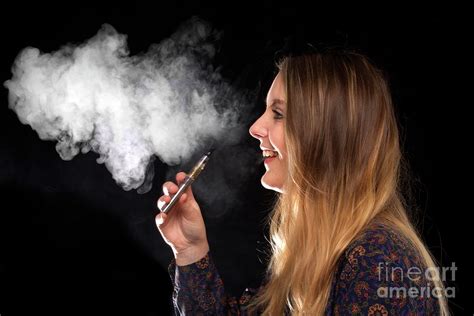 teenage girl vaping photograph by victor de schwanberg science photo library