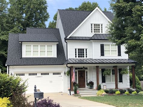 white ranch house black gutters - Trudi Carrington
