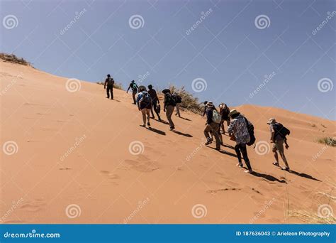 People Climbing A Desert Dune Editorial Stock Photo Image Of Light