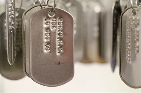 What to put on dog tag. Who Cleans All Those Veteran Dog Tags in Museum Exhibit ...
