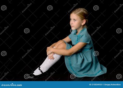 Cute Girl Sitting On Floor Hugging Her Knees Stock Image Image Of