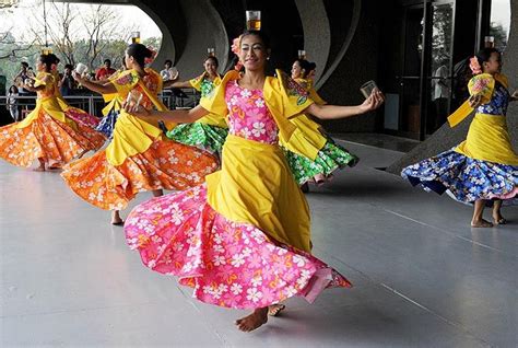Filipino Dancers Perform The Binasuan A Dance Using Glasses With
