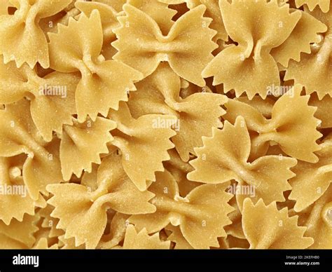 Close Up Of Dry Uncooked Italian Pasta Farfalle Background Of Pasta In