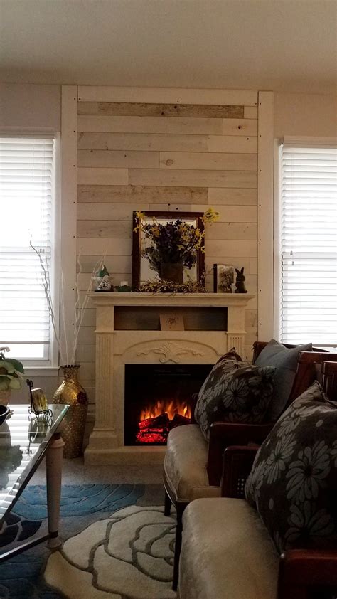 We had a couple of pallets laying around so we tore one of them apart and used the wood from that. DIY pallet wall with trim in living room | Diy pallet wall, Rustic wooden sign, Apartment living ...