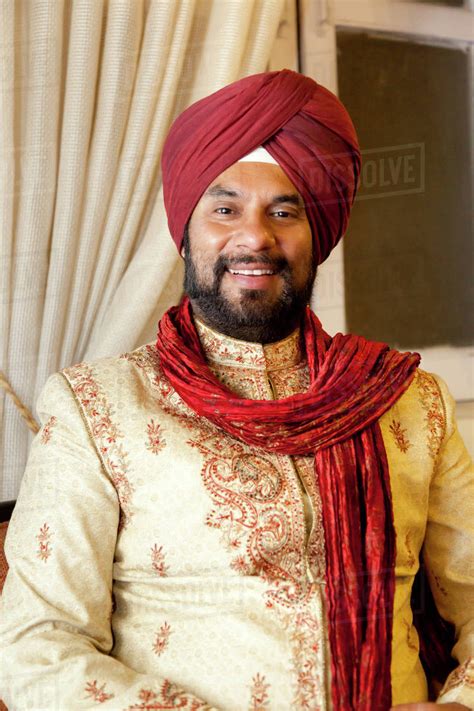 Smiling Mixed Race Man In Traditional Indian Clothing Stock Photo