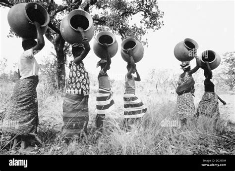 Women Carrying Pots Burkina Faso Stock Photo Alamy