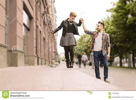 Concept Of Lovelove Couple Holding Hands Walking Down The Street Stock