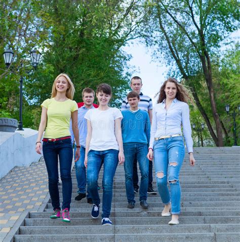 Group Of Smiling Teenagers Walking Outdoors Stock Photo Image Of