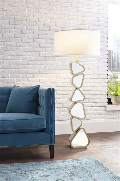 Uttermost selvino brushed brass table lamp. Pebble-shaped mirrors encased in a brushed brass finish ...