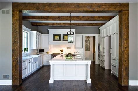 Just had the heavily faux finished dark brown and gold crackled and very glazed kitchen cabinets torn out, which helps that room a lot, and new cream ones put in. Vacation never ends for family living in Pickell Concept House