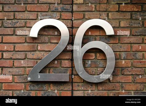 Figures For The Number Twenty Six Attached To The Outside Wall Of An