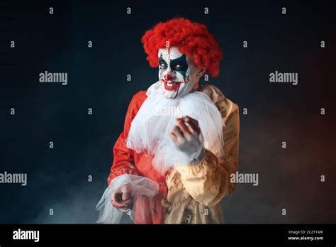 Portrait Of Scary Bloody Clown With Crazy Eyes Man With Makeup In