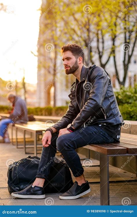 Young Man Sitting On A Bench Stock Photo Image Of Stylish Outdoors